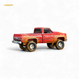 Auto World 1983 Chevrolet Silverado K10 4x4 Muddy Lifted 1:64